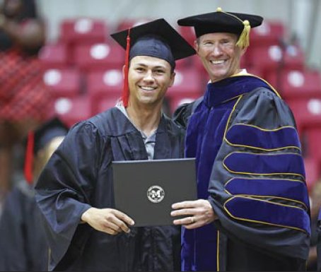EMCC graduate Nathan White receives his associate’s degree during graduation.